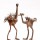 pair of copper ostrich sculptures on white background thumbnail